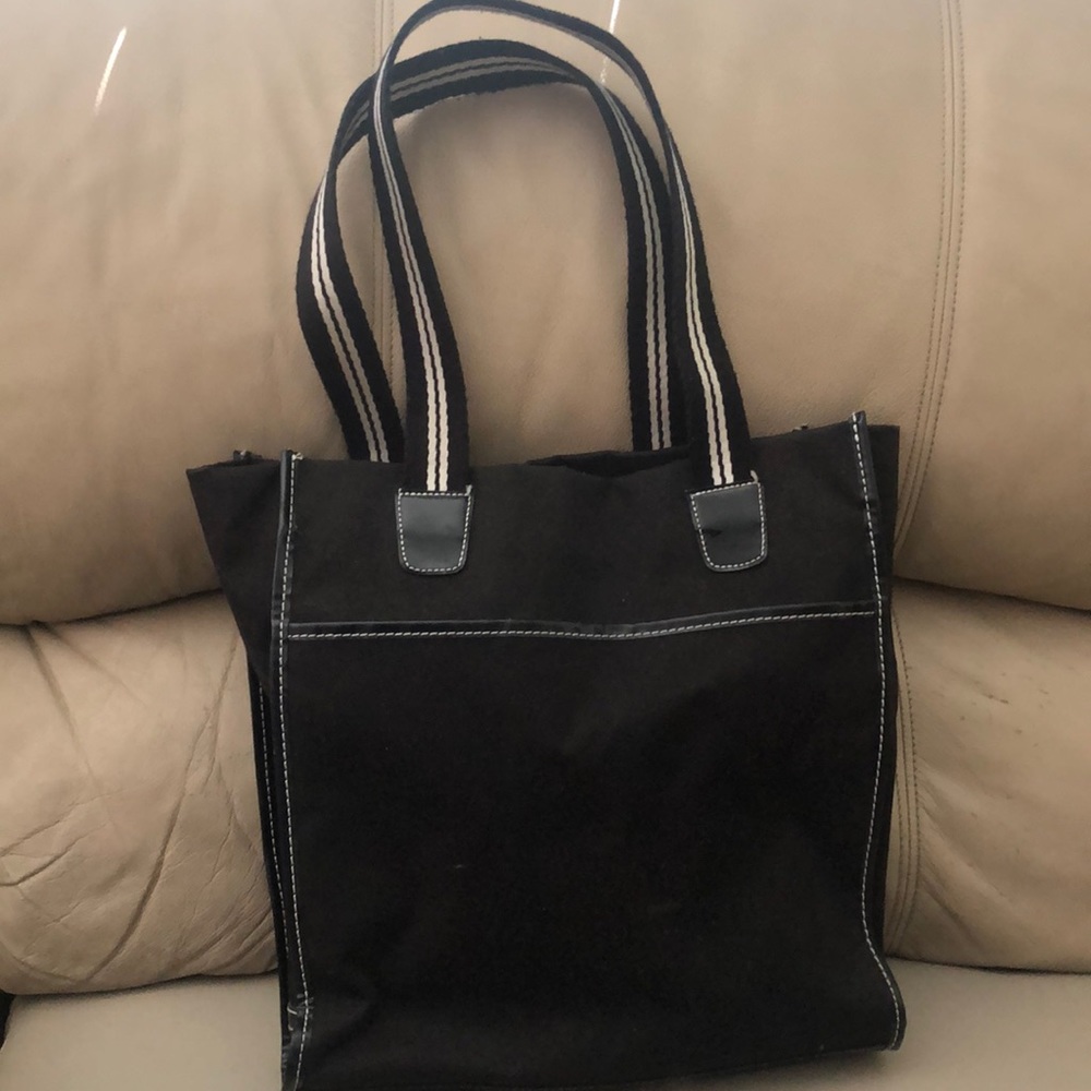 Black purse with black and white strip handles
